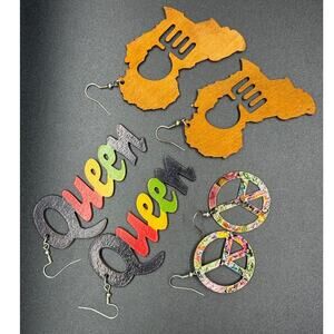 Silver tone and wooden dangle or drop earrings featuring Afrocentric